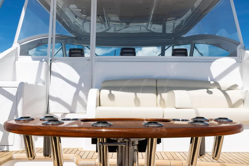  Yacht Photos Pics 2021 Viking 44 Open yacht interior with luxurious seating and polished wood table.