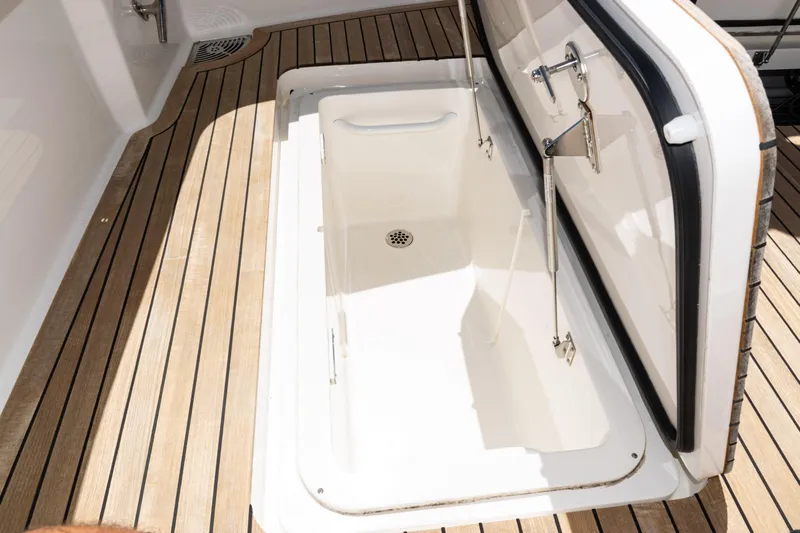  Yacht Photos Pics 2021 Viking 44 Open yacht storage compartment with teak flooring.