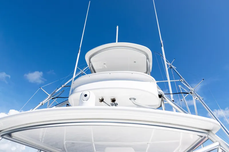  Yacht Photos Pics 2021 Viking 44 Open yacht against a clear blue sky, showcasing sleek design and structure.