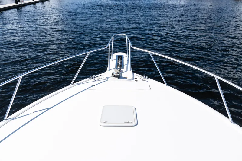  Yacht Photos Pics Bow view of 2021 Viking 44 Open yacht on calm water.