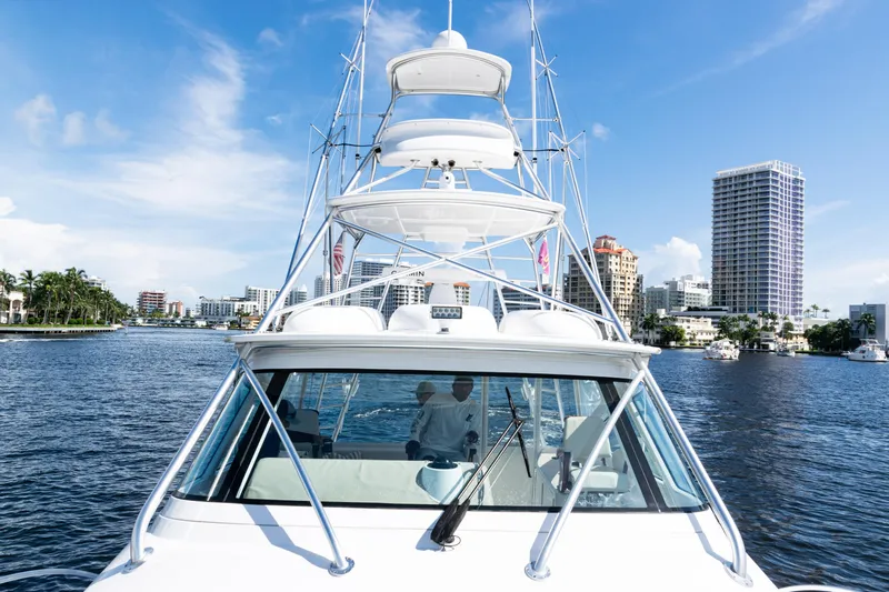  Yacht Photos Pics 2021 Viking 44 Open yacht cruising in a sunny urban waterfront setting.