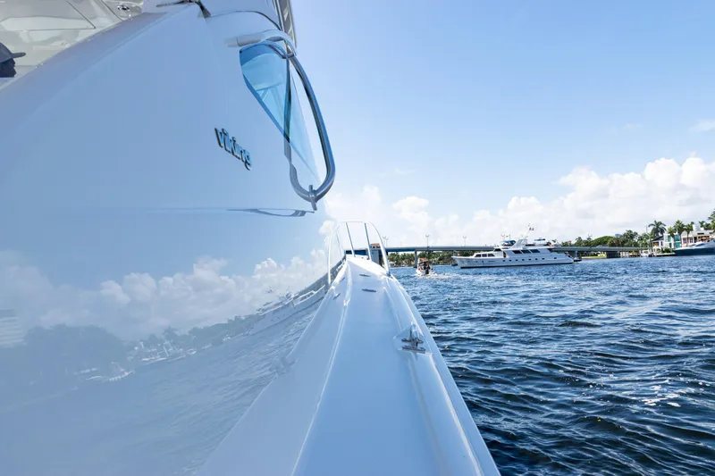  Yacht Photos Pics 2021 Viking 44 Open yacht on water, side view with clear sky.