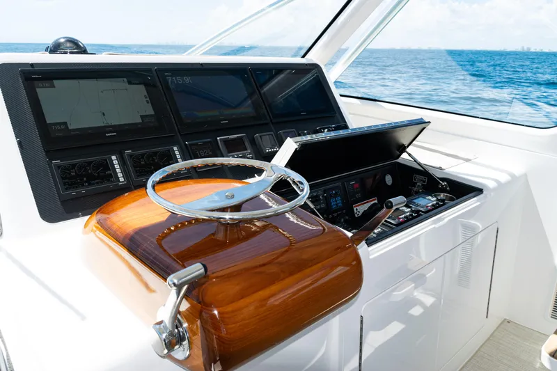  Yacht Photos Pics Helm of 2021 Viking 44 Open yacht with advanced navigation displays and controls.