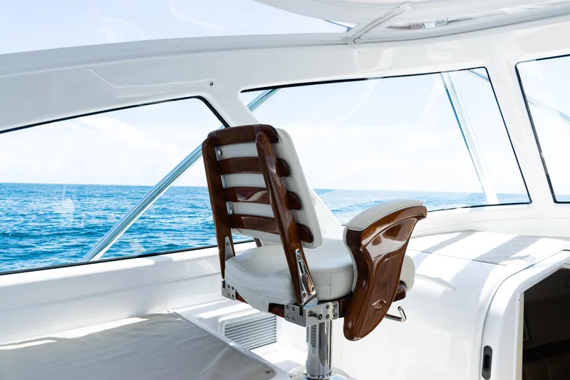  Yacht Photos Pics Captain's chair on 2021 Viking 44 Open yacht with ocean view.