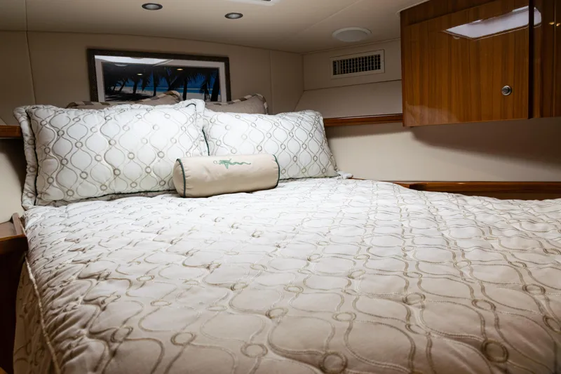  Yacht Photos Pics Luxurious cabin interior of 2021 Viking 44 Open yacht with elegant bedding.