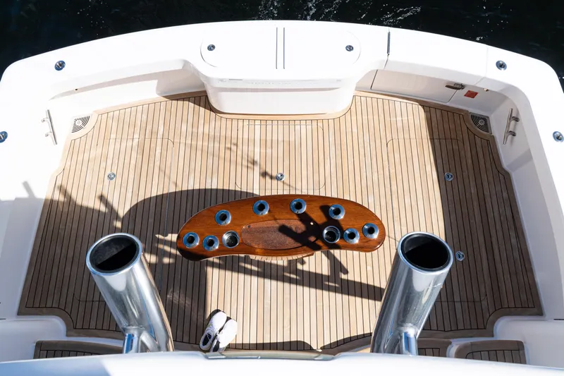  Yacht Photos Pics Cockpit of 2021 Viking 44 Open yacht with teak flooring and fishing rod holders.