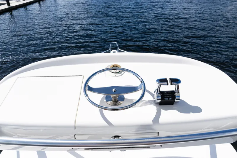  Yacht Photos Pics Steering wheel and controls of 2021 Viking 44 Open yacht on water.