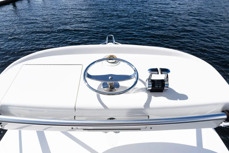  Yacht Photos Pics Steering console of 2021 Viking 44 Open yacht on calm water.