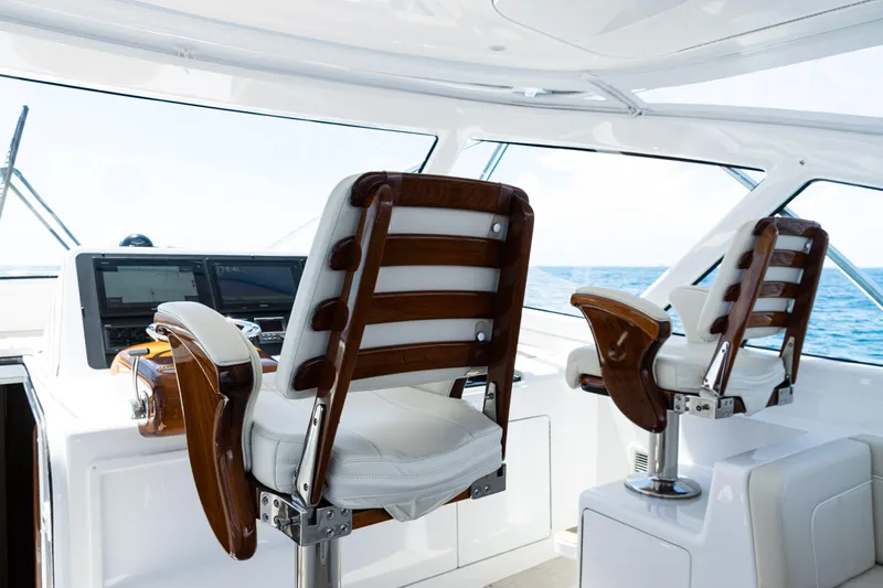  Yacht Photos Pics Luxurious helm chairs on 2021 Viking 44 Open yacht with ocean view.