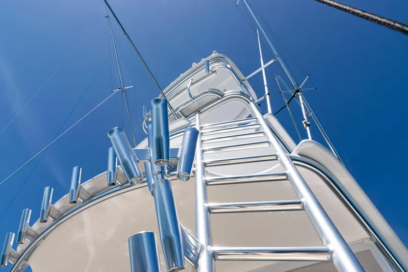  Yacht Photos Pics 2021 Viking 44 Open yacht tower with ladder against clear blue sky.