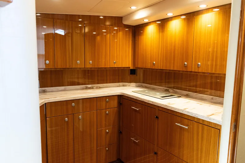  Yacht Photos Pics Luxurious wooden cabinetry in 2021 Viking 44 Open yacht kitchen interior.