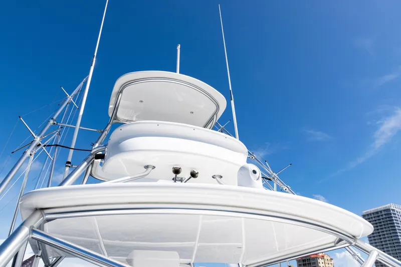  Yacht Photos Pics 2021 Viking 44 Open yacht against clear blue sky, showcasing sleek design and structure.