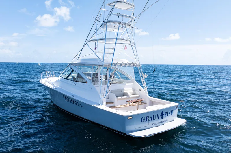  Yacht Photos Pics 2021 Viking 44 Open yacht on open sea, featuring sleek design and fishing tower.