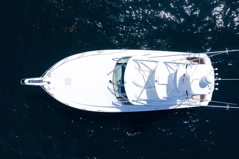  Yacht Photos Pics Overhead view of 2021 Viking 44 Open yacht on dark blue water.