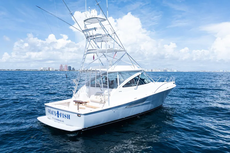  Yacht Photos Pics 2021 Viking 44 Open yacht on open sea under clear blue sky.