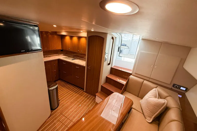  Yacht Photos Pics Luxurious interior of 2021 Viking 44 Open yacht with modern kitchen and seating area.