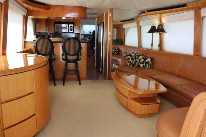  Yacht Photos Pics Luxurious interior of 2004 Cheoy Lee 68 yacht with modern furnishings and kitchen.