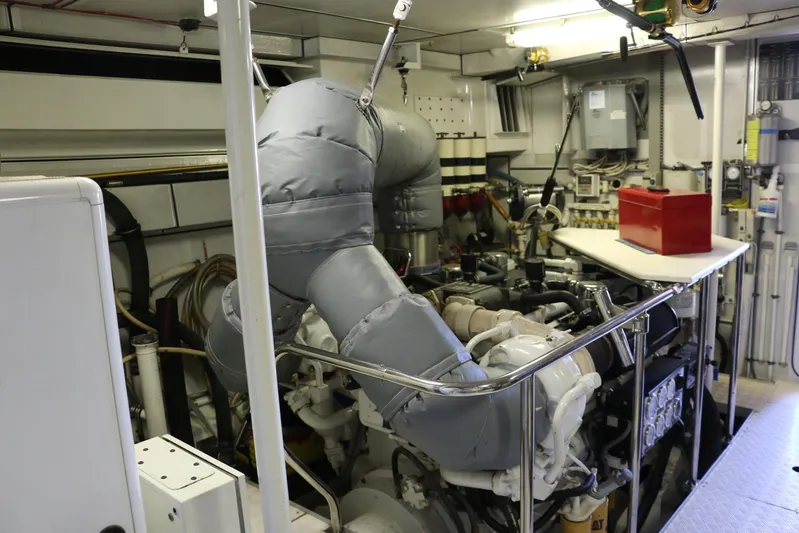  Yacht Photos Pics Engine room of a 2004 Cheoy Lee 68 yacht, featuring complex machinery and piping.