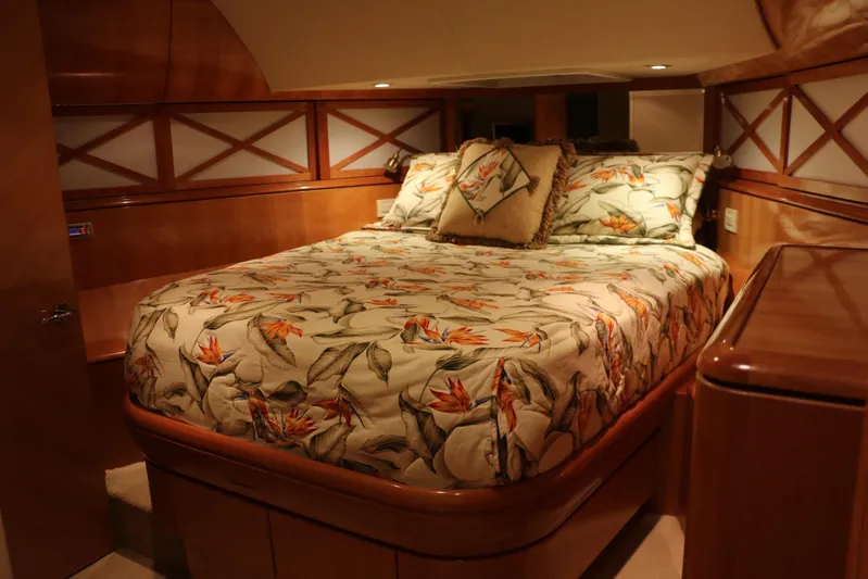  Yacht Photos Pics Luxurious bedroom interior of 2004 Cheoy Lee 68 yacht with floral bedding.