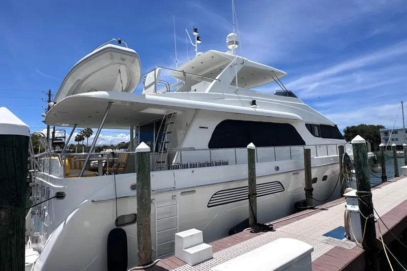  Yacht Photos Pics 2004 Cheoy Lee 68 yacht docked under a clear blue sky.