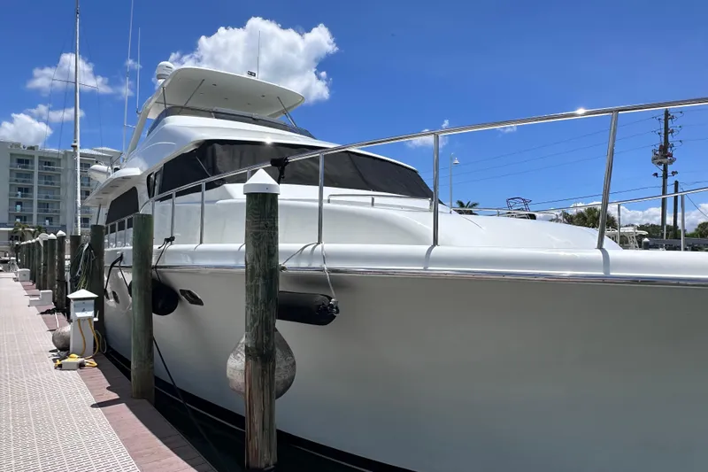  Yacht Photos Pics 2004 Cheoy Lee 68 yacht docked under a clear blue sky.