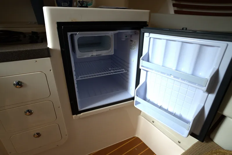  Yacht Photos Pics Open refrigerator inside 2007 Grady-White Express 330 boat cabin.