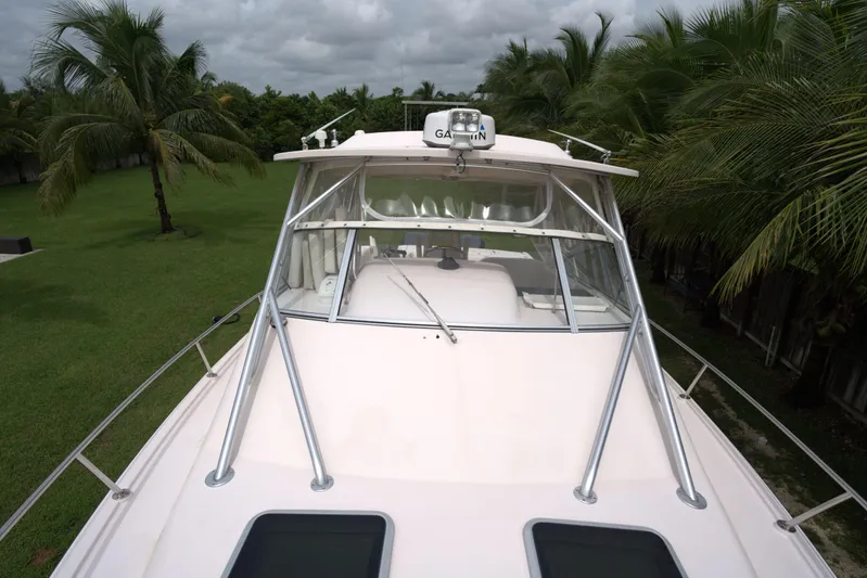  Yacht Photos Pics 2007 Grady-White Express 330 boat with palm trees in the background.