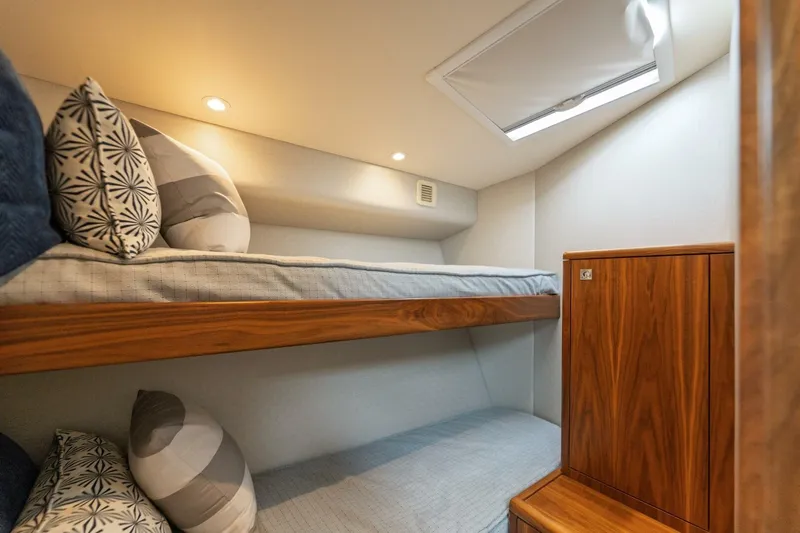 Reely Yacht Photos Pics Cozy cabin with bunk beds in 2018 Hatteras GT45X Flybridge yacht.
