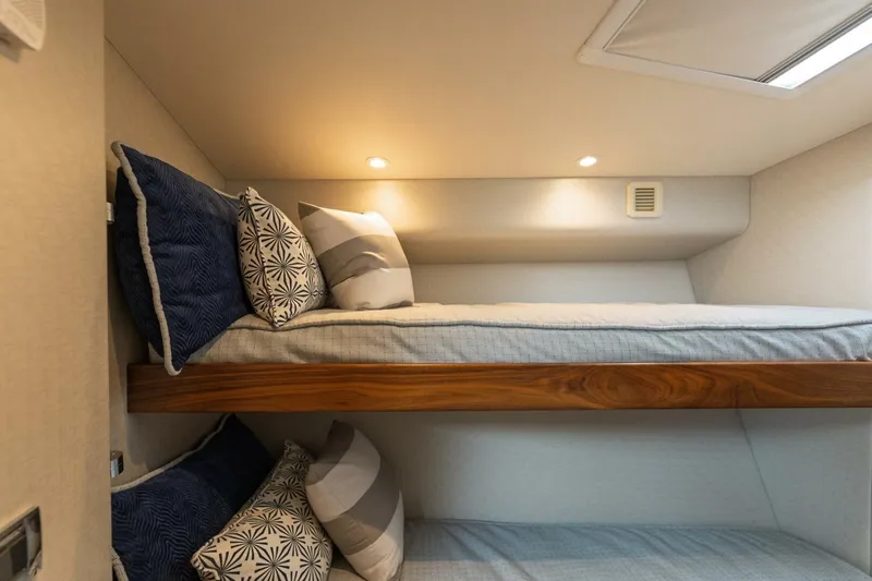 Reely Yacht Photos Pics Bunk beds with decorative pillows in 2018 Hatteras GT45X Flybridge yacht cabin.