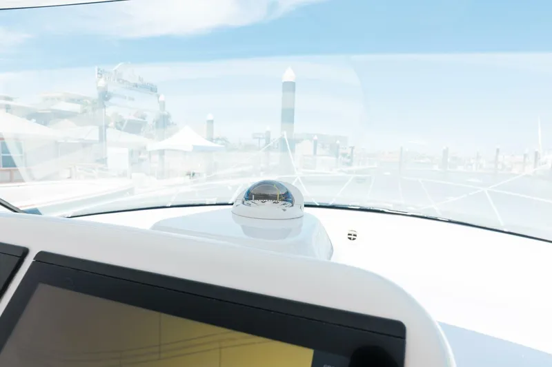 Reely Yacht Photos Pics 2018 Hatteras GT45X Flybridge helm with navigation equipment and marina view.