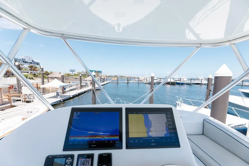 Reely Yacht Photos Pics Flybridge view from 2018 Hatteras GT45X, featuring navigation screens and marina backdrop.