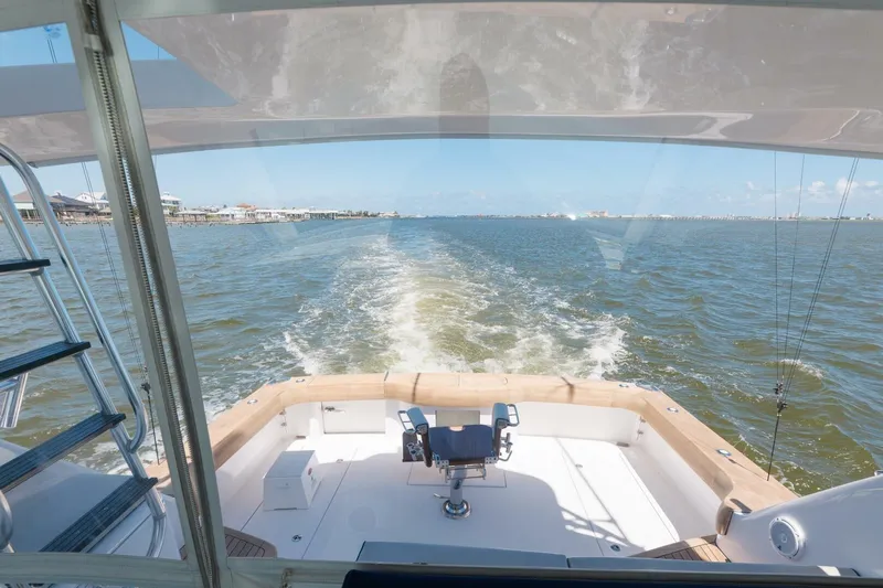 Reely Yacht Photos Pics 2018 Hatteras GT45X Flybridge cruising on open water, view from the deck.