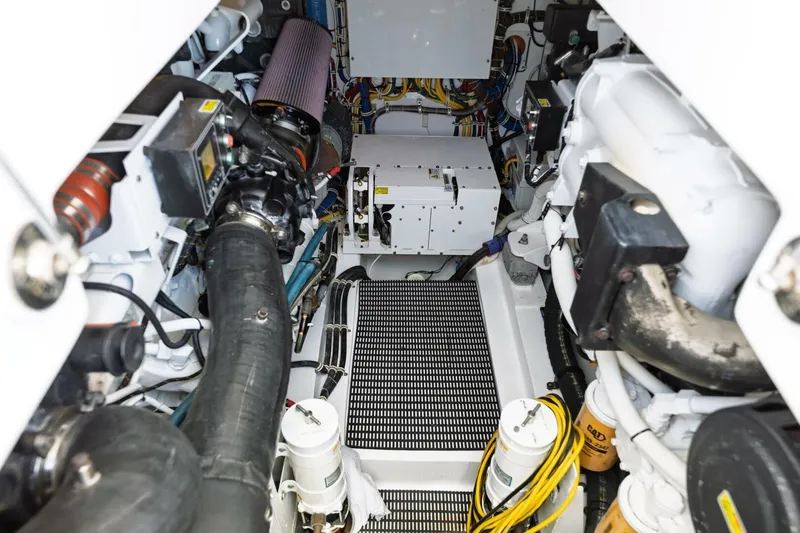 Reely Yacht Photos Pics Engine room of 2018 Hatteras GT45X Flybridge, showcasing mechanical components and wiring.