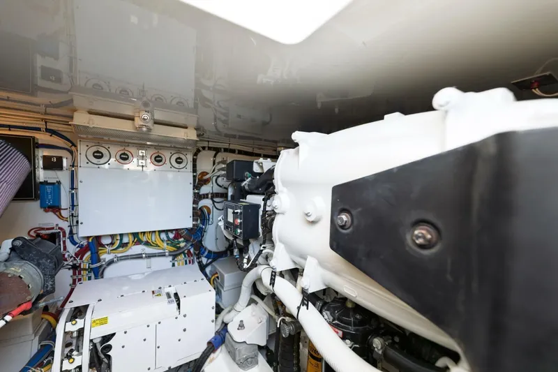 Reely Yacht Photos Pics Engine room of 2018 Hatteras GT45X Flybridge, showcasing mechanical components and wiring.