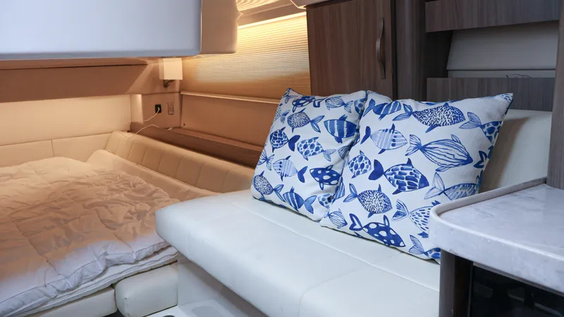  Yacht Photos Pics Interior of 2022 Regal 36 XO yacht with cozy seating and decorative pillows.