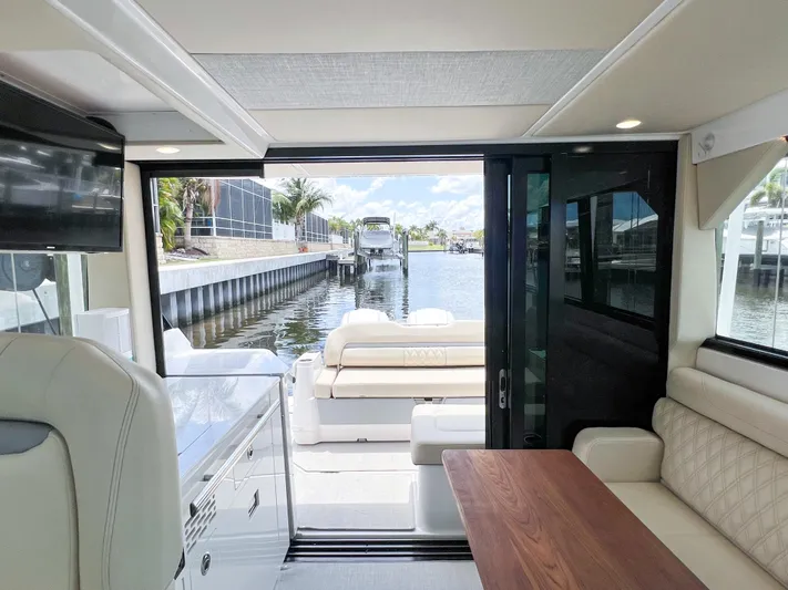  Yacht Photos Pics Interior view of 2022 Regal 36 XO yacht with open rear deck.