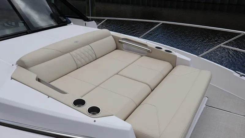  Yacht Photos Pics Luxurious seating on the 2022 Regal 36 XO boat, featuring beige upholstery and cup holders.