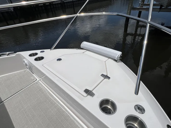  Yacht Photos Pics 2022 Regal 36 XO boat bow with cup holders and storage compartment.
