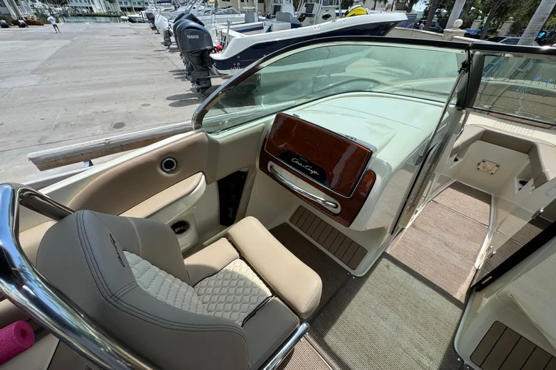  Yacht Photos Pics 2023 Chris-Craft Launch 25 GT interior with luxurious seating and sleek dashboard design.