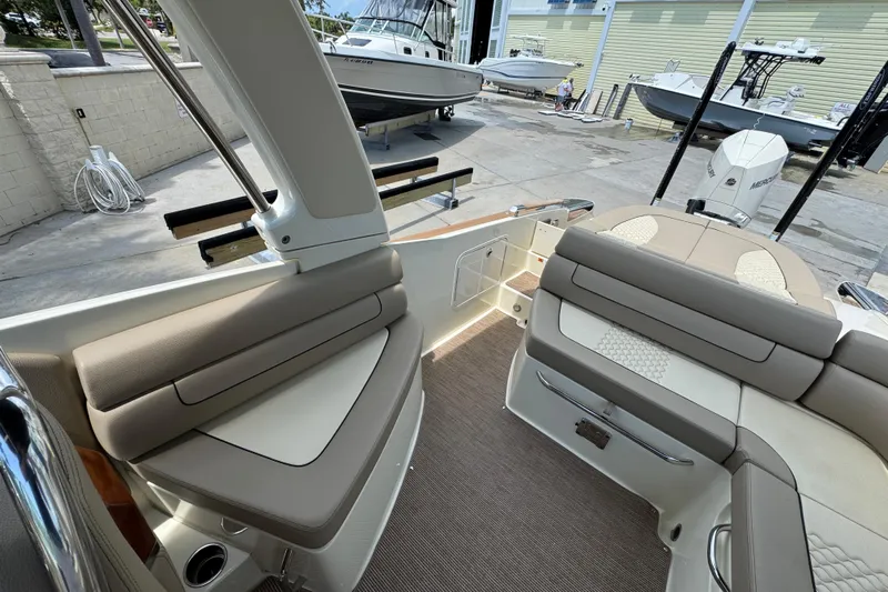  Yacht Photos Pics 2023 Chris-Craft Launch 25 GT interior with beige seating and modern design.