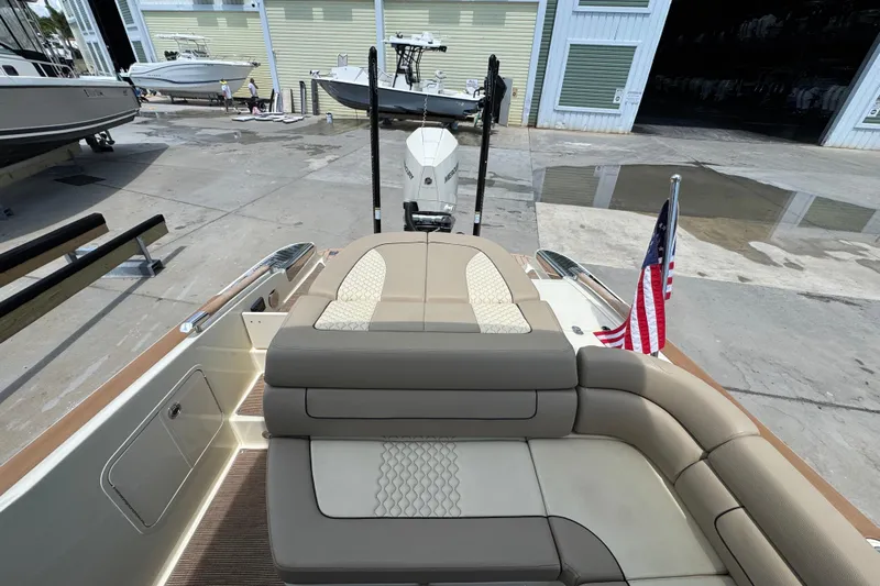  Yacht Photos Pics 2023 Chris-Craft Launch 25 GT boat with elegant seating and American flag.