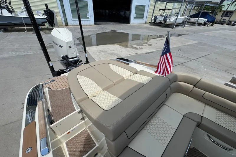  Yacht Photos Pics 2023 Chris-Craft Launch 25 GT boat with luxurious seating and American flag.