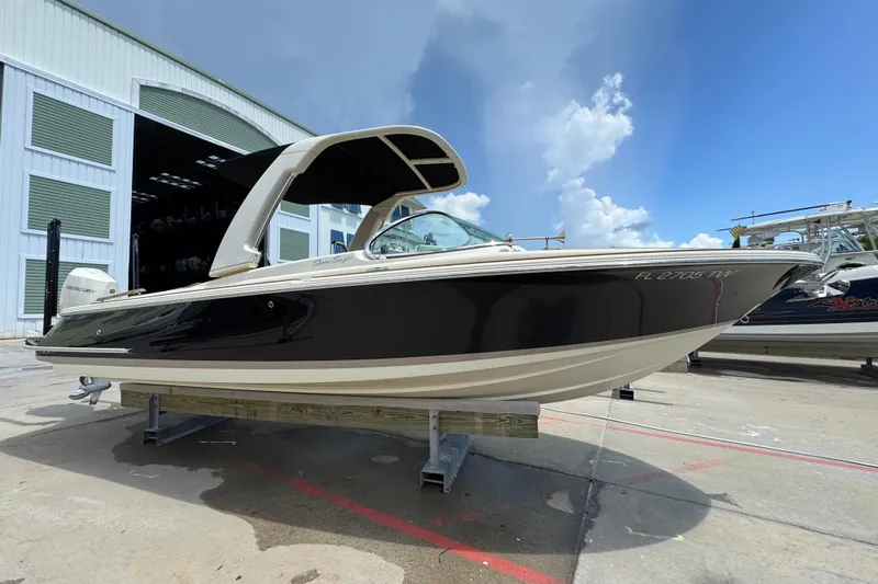  Yacht Photos Pics 2023 Chris-Craft Launch 25 GT boat on display outside a storage facility.