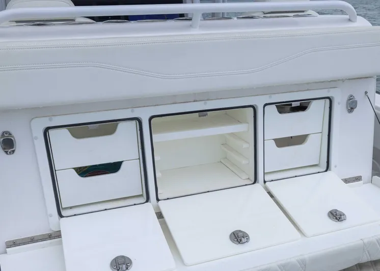  Yacht Photos Pics 2023 Invincible 33 Catamaran storage compartments with white finish and sleek design.