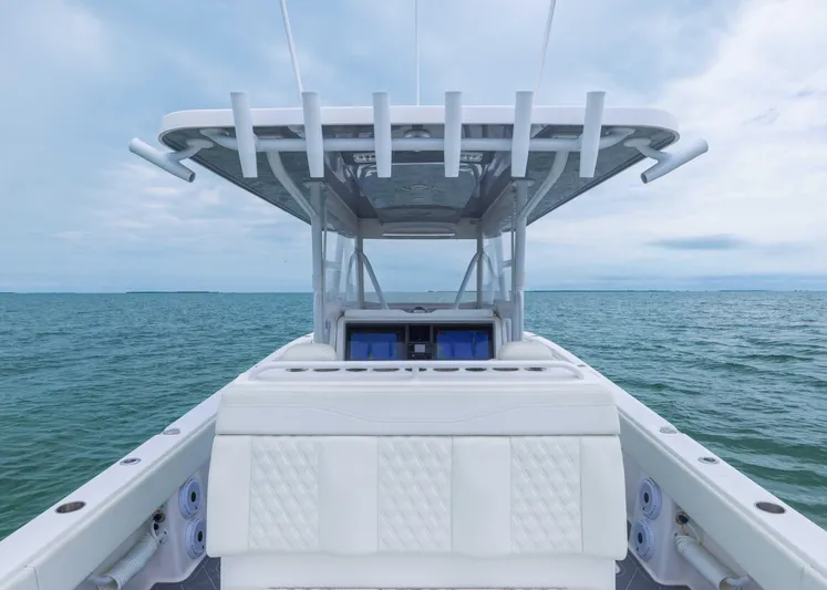  Yacht Photos Pics 2023 Invincible 33 Catamaran on open water, showcasing sleek design and spacious deck.