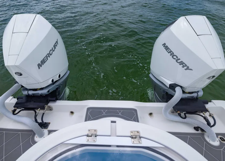  Yacht Photos Pics 2023 Invincible 33 Catamaran with dual Mercury outboard engines on water.