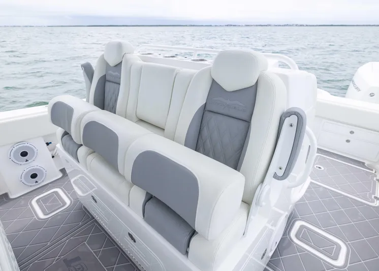  Yacht Photos Pics Luxury seating on 2023 Invincible 33 Catamaran, featuring elegant gray and white upholstery.