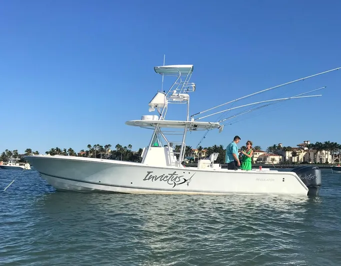 Invictus Yacht Photos Pics 2006 Regulator 32 Center Console boat on the water.