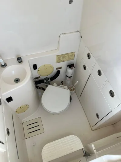 Invictus Yacht Photos Pics Interior of a 2006 Regulator 32 Center Console boat toilet.
