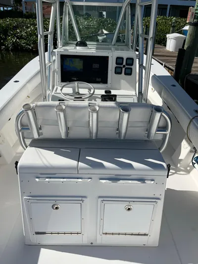 Invictus Yacht Photos Pics 2006 Regulator 32 Center Console with helm and storage compartments.